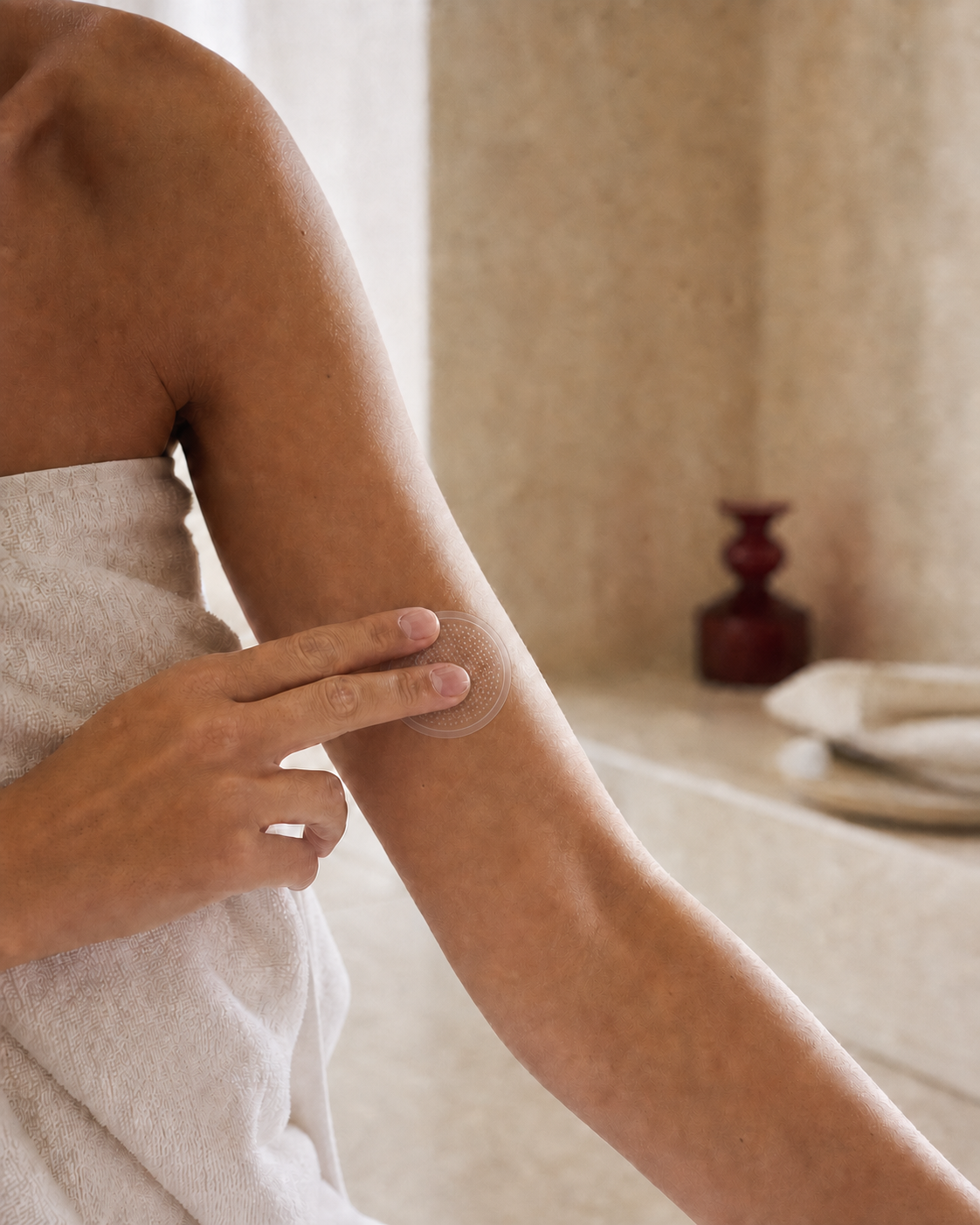Woman applying a round patch during a calm skincare ritual